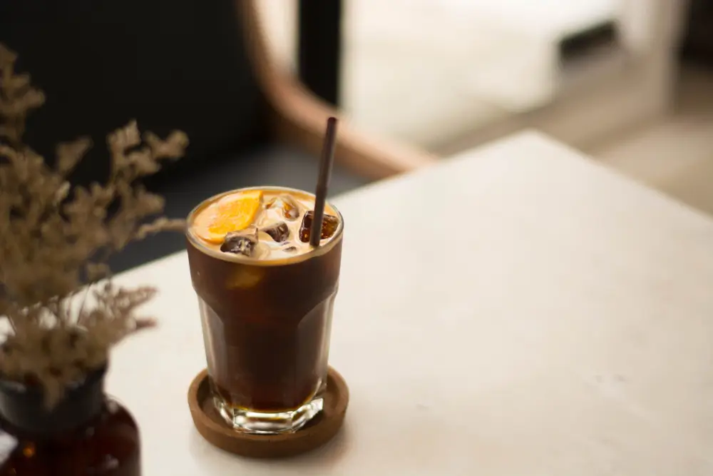 nitro cold brew coffee being served on a white kitchen counter in a classic manner